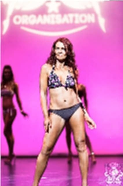 Helena at 50 on stage in a bikini at Miss Galaxy Universe; embracing confidence and strength at any age