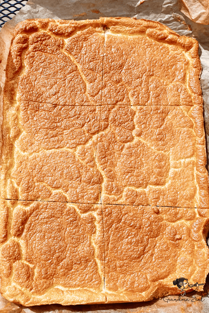 Freshly baked keto cloud bread for sandwiches sliced into 6 even squares.