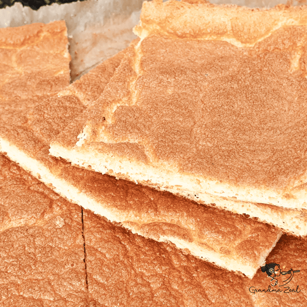Close-up image of stacked keto cloud bread rectangles, freshly cut.
