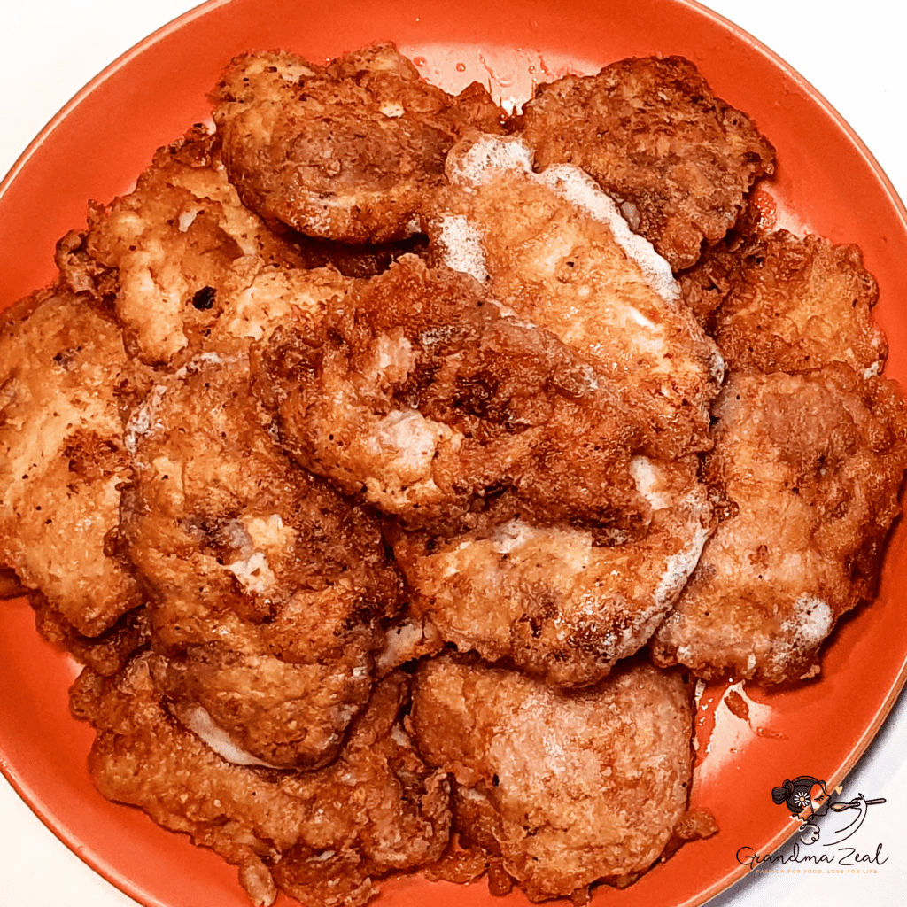 A plate full of crispy fried chicken pieces, ready to serve