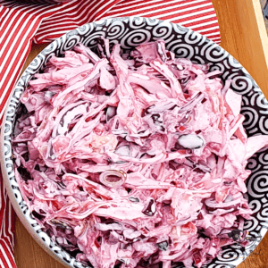 Bowl of red cabbage coleslaw with creamy dressing