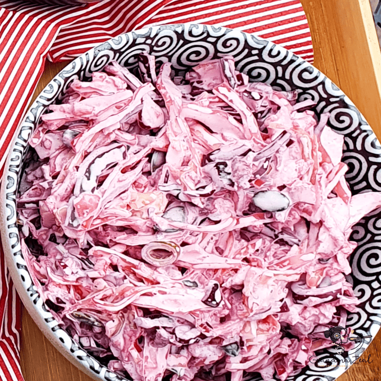Bowl of red cabbage coleslaw with creamy dressing