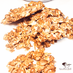 Broken pieces of low-carb granola with nuts on a white table