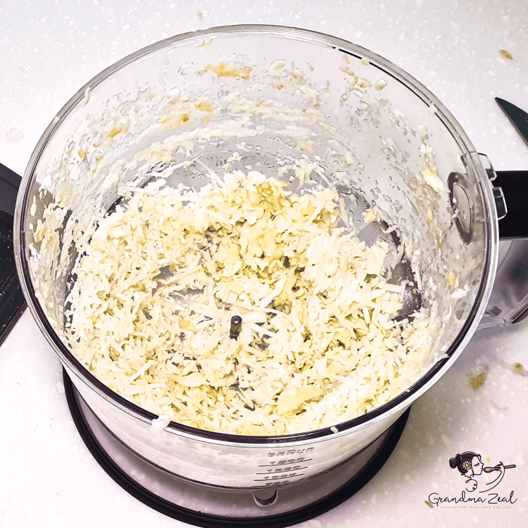 Chopping cabbage in a Braun food processor for veggie hash browns