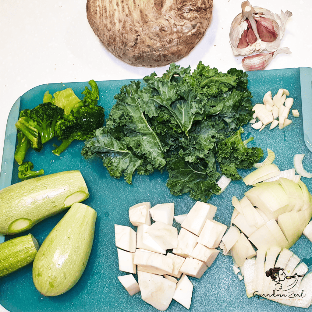 Fresh vegetables prepared for healthy green vegetable soup with cheese, some partly chopped