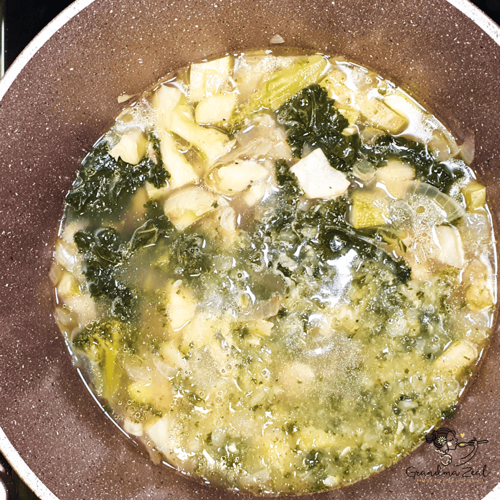 Cooked vegetables in a pot ready to be blended for low-carb vegetable soup with cheese