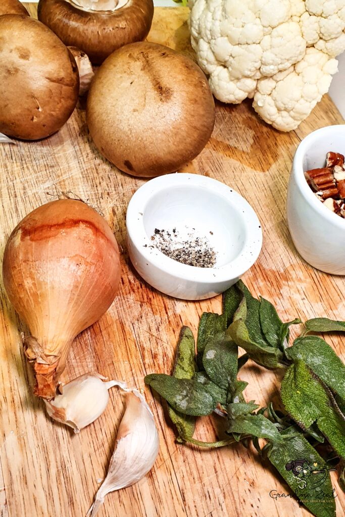 MUSHROOM AND CAULIFLOWER ROAST | YOUR NO. 1 EASY & DELICIOUS VEGETARIAN DISH Ingredients for mushroom and cauliflower roast: cauliflower, mushrooms, onion, garlic, sage, pecans, and oil
