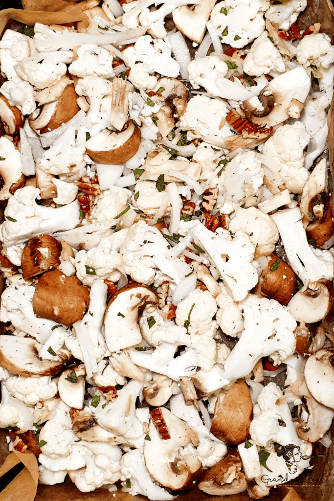 MUSHROOM AND CAULIFLOWER ROAST | YOUR NO. 1 EASY & DELICIOUS VEGETARIAN DISH Mixed mushroom and cauliflower roast ingredients spread evenly in a baking dish, ready for the oven