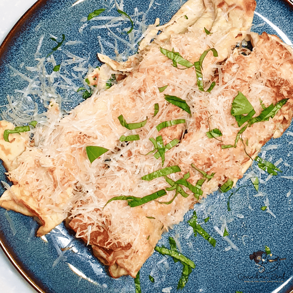 serving spinach filled crepes