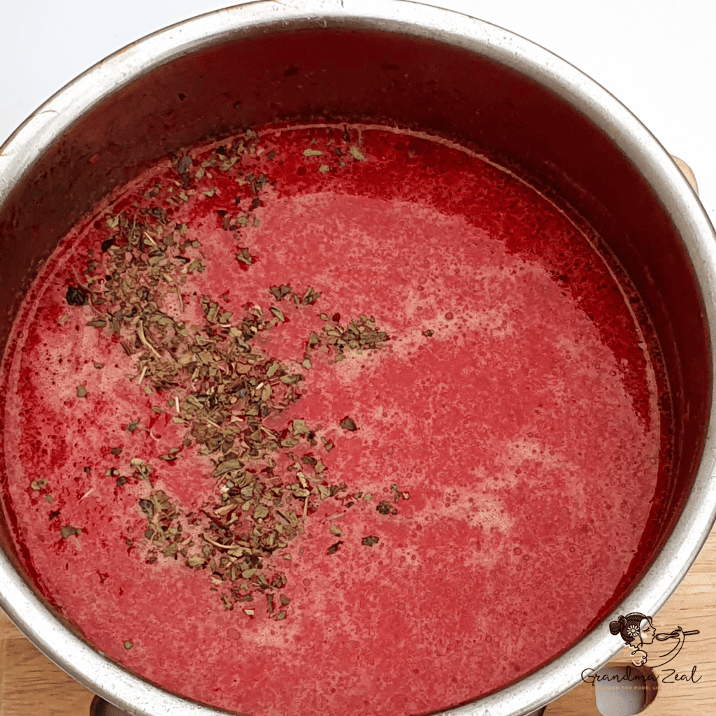 Freshly cooked beetroot and root vegetable soup in a pot