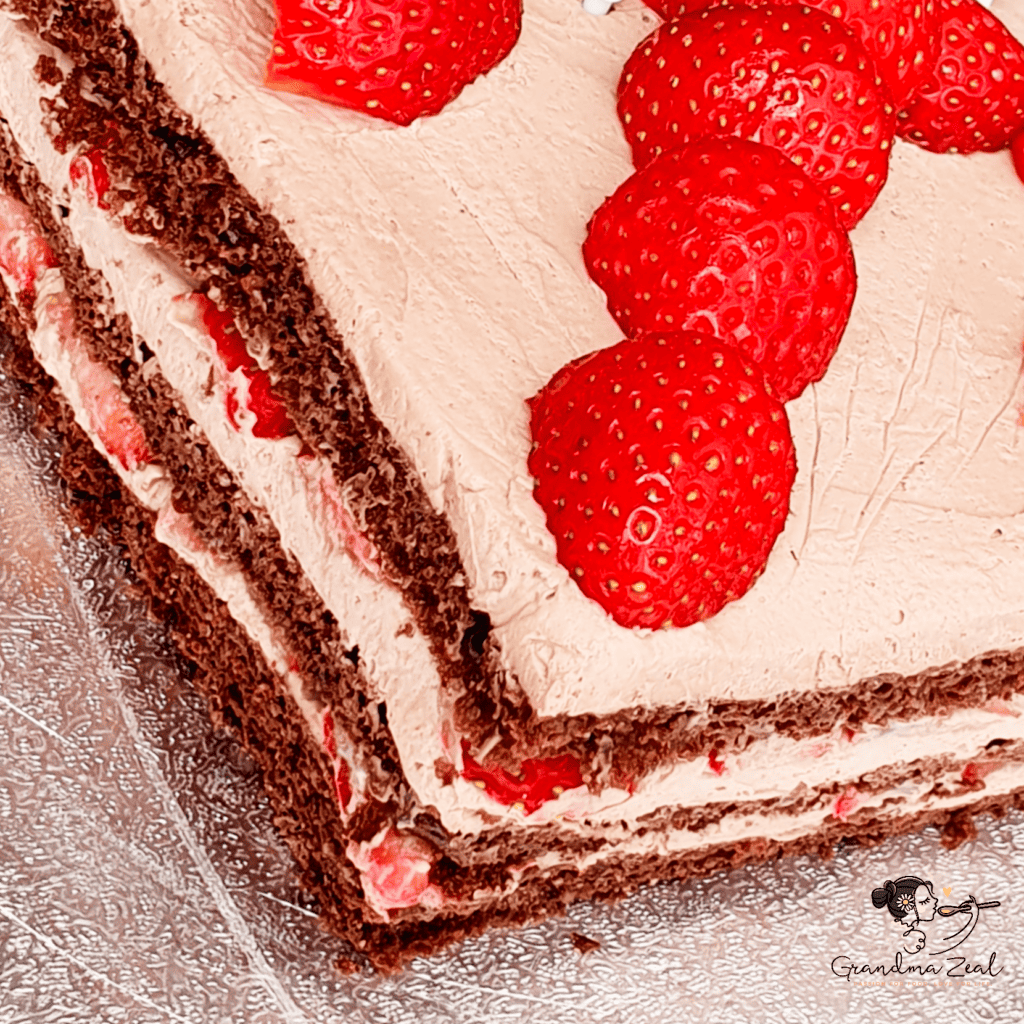 square almond flour chocolate cake decorated with strawberries