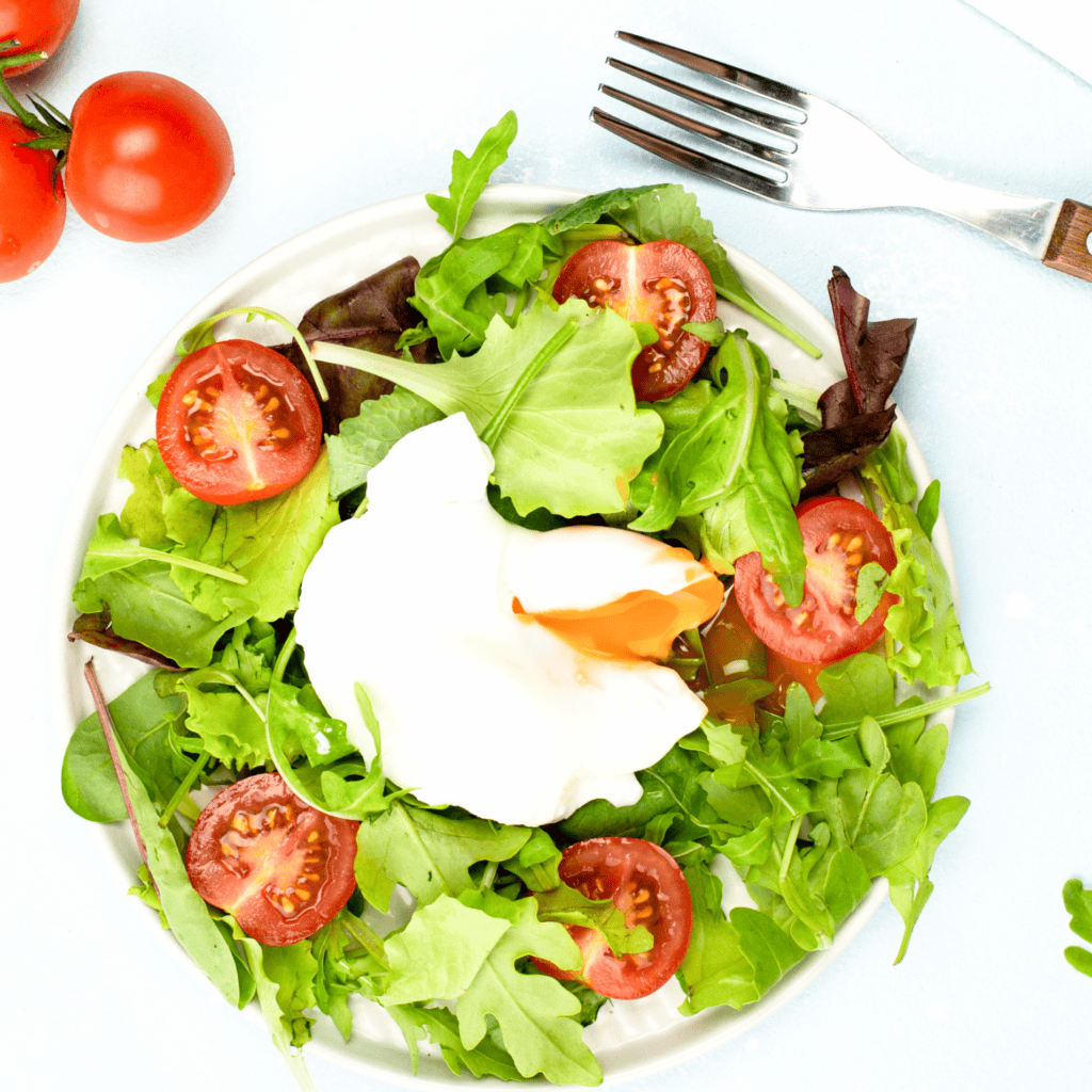 HOW TO COOK PERFECT POACHED EGG green salad with poached egg in a bowl