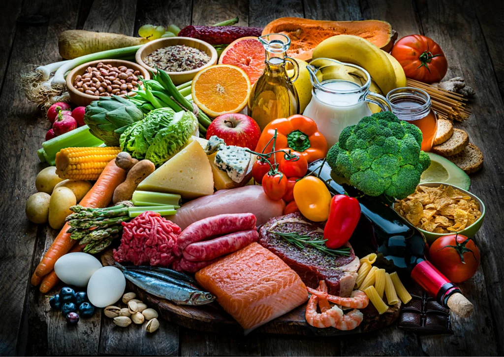 a selection of healthy food speeded on the table,, illustrating healthy lifestyle