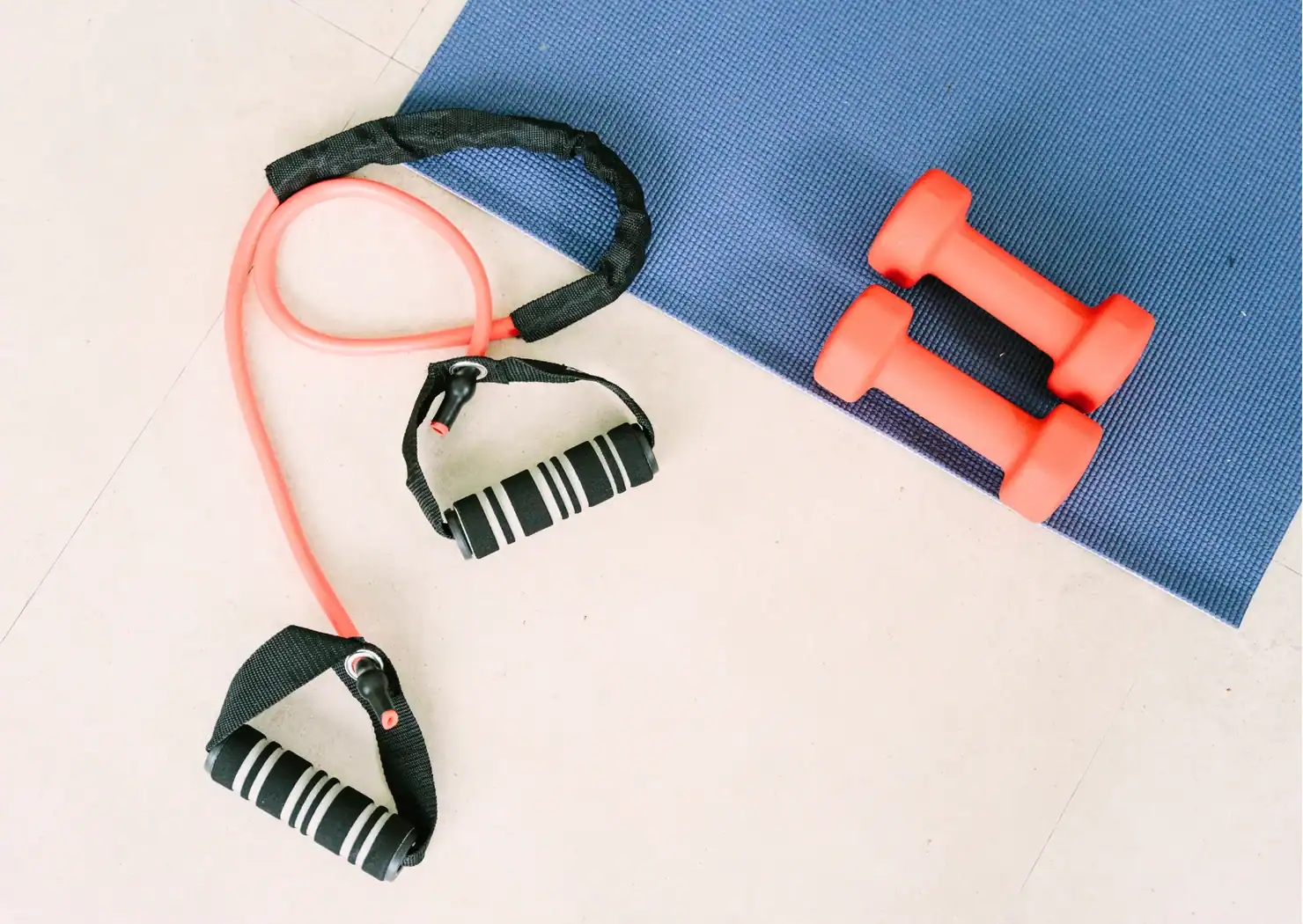Home Fitness In Midlife | Strength, Energy and Everyday Life Image of a yoga mat, weights, and resistance band; fitness content on GrandmaZeal