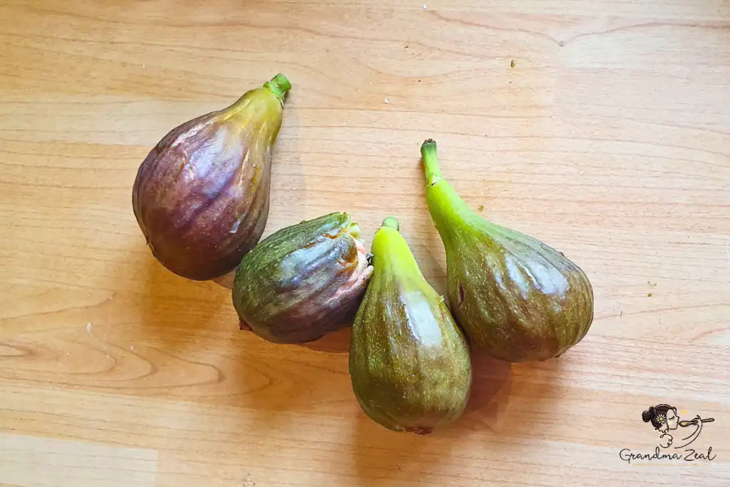 Fresh figs on a kitchen worktop, ready to use in a homemade protein bars recipe.