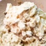 A spoonful of creamy homemade potato salad showing texture and dressing