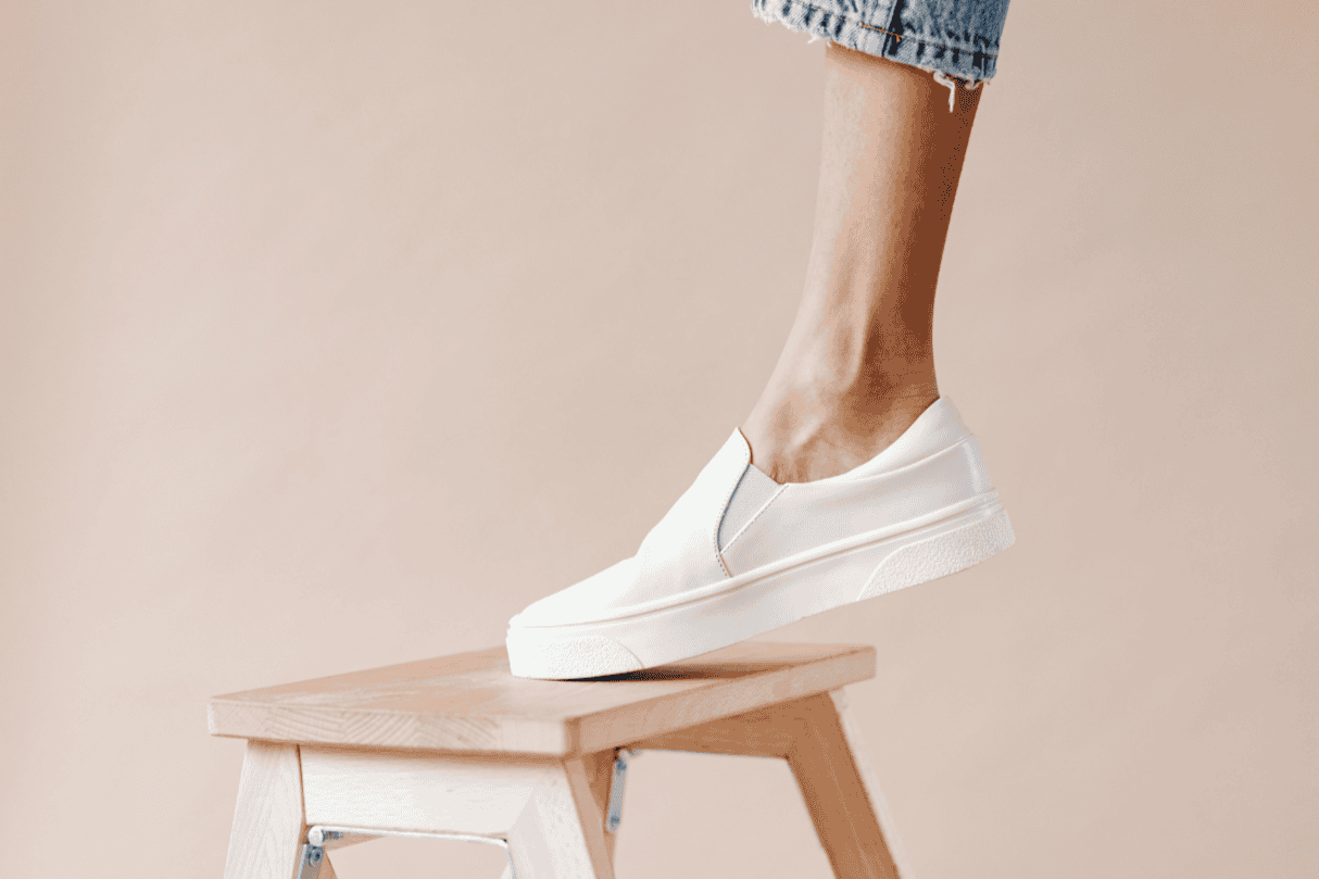 Foot stepping onto a small stool, representing balance and mobility exercises.